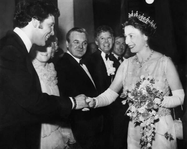Queen shaking hands with Tom Jones at Royal Variety